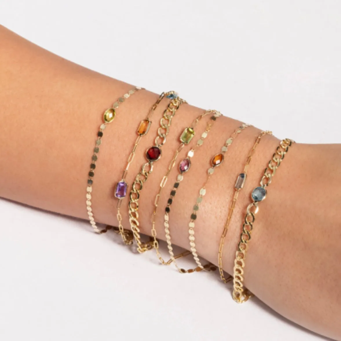 Bezel set emerald cut gemstone on paperclip chain